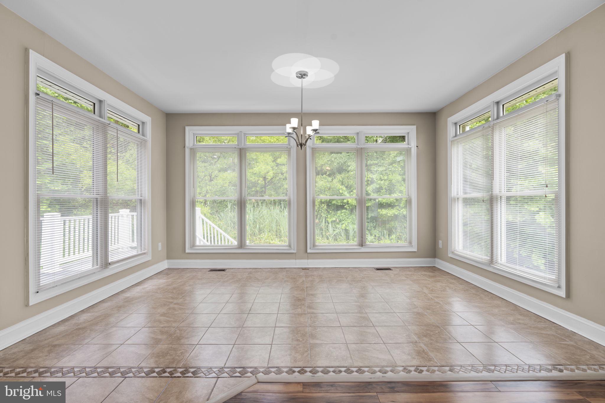 8024 Solley Road Glen Burnie, MD 21060 - Photo 33 of 83 a view of an empty room with wooden floor and a window