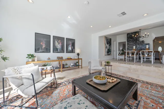 a living room with furniture and a table