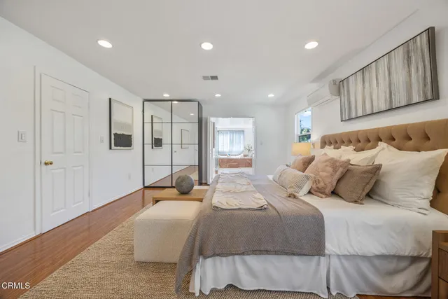 a bedroom with bed and a window