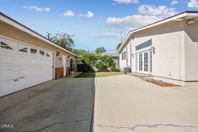 a view of a house with a street