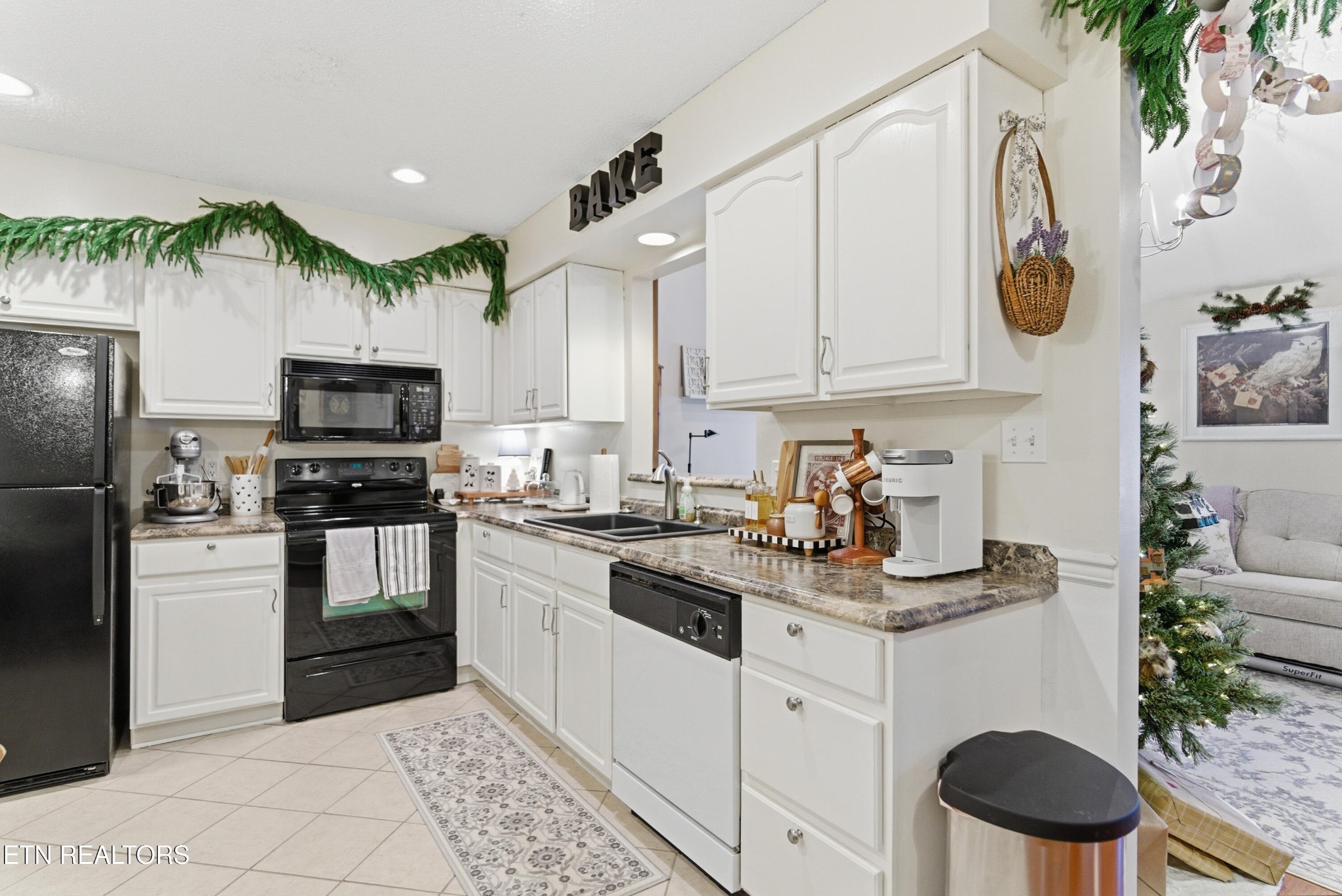 8009 Chambord Way Powell, TN 37849 - Photo 11 of 32 a kitchen with a sink a stove and refrigerator