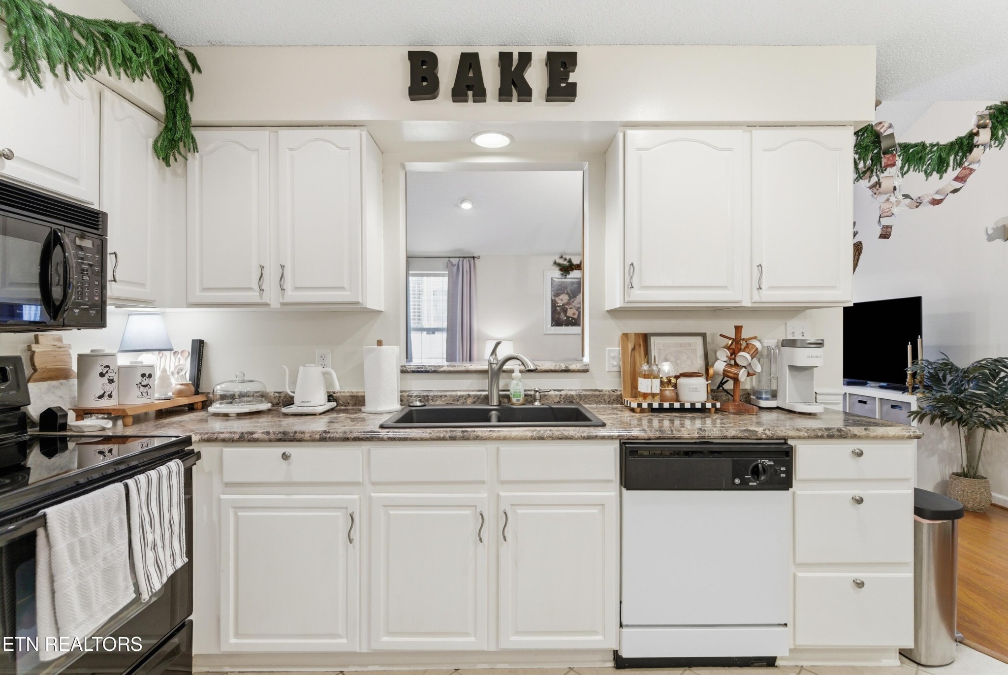 8009 Chambord Way Powell, TN 37849 - Photo 13 of 32 a kitchen with stainless steel appliances white cabinets and a sink