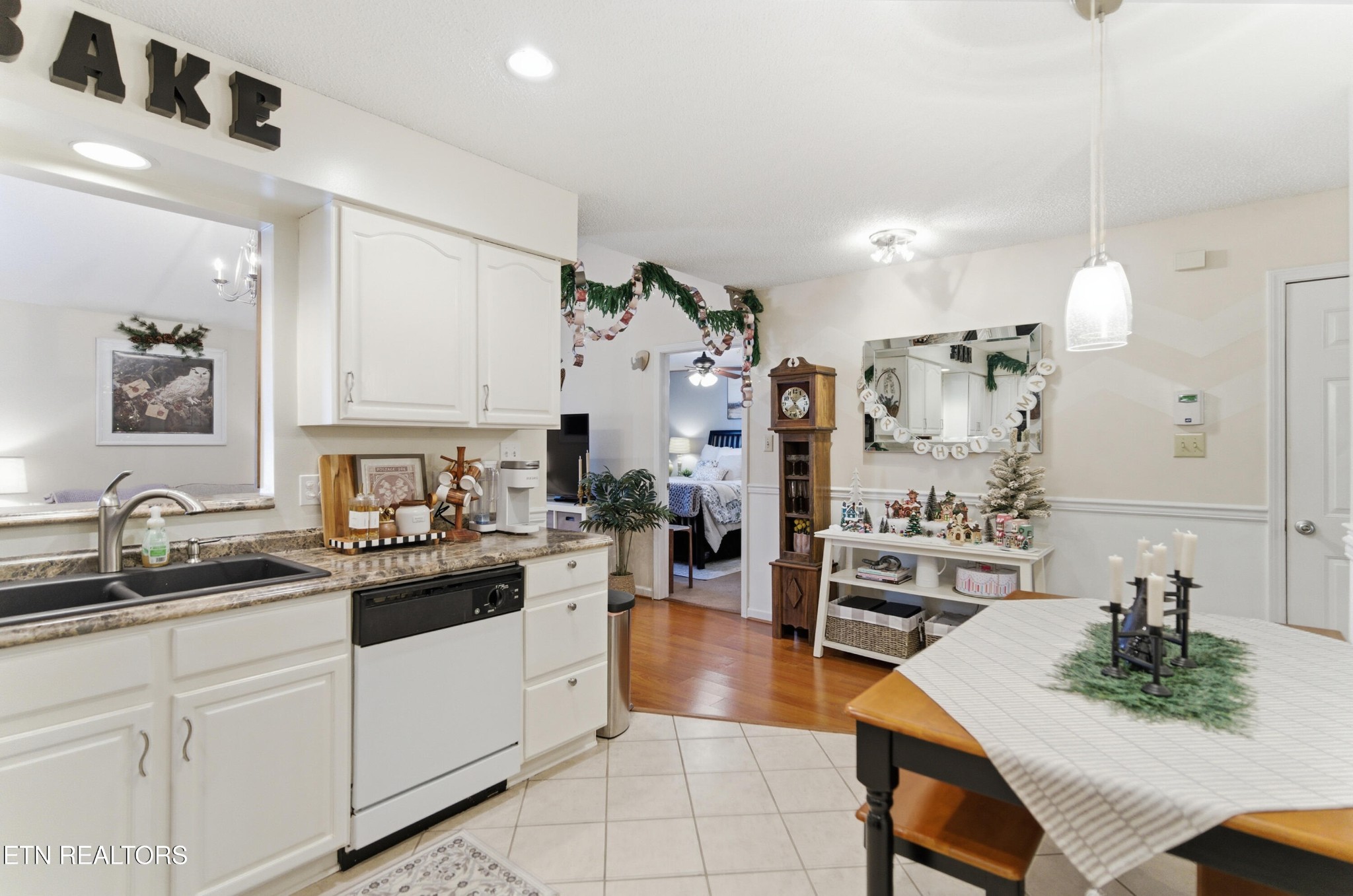 8009 Chambord Way Powell, TN 37849 - Photo 15 of 32 a kitchen with white cabinets and appliances
