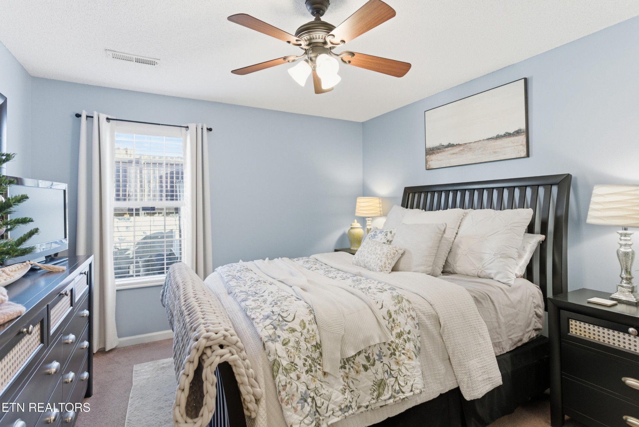 8009 Chambord Way Powell, TN 37849 - Photo 19 of 32 a bed room with a bed and a chandelier