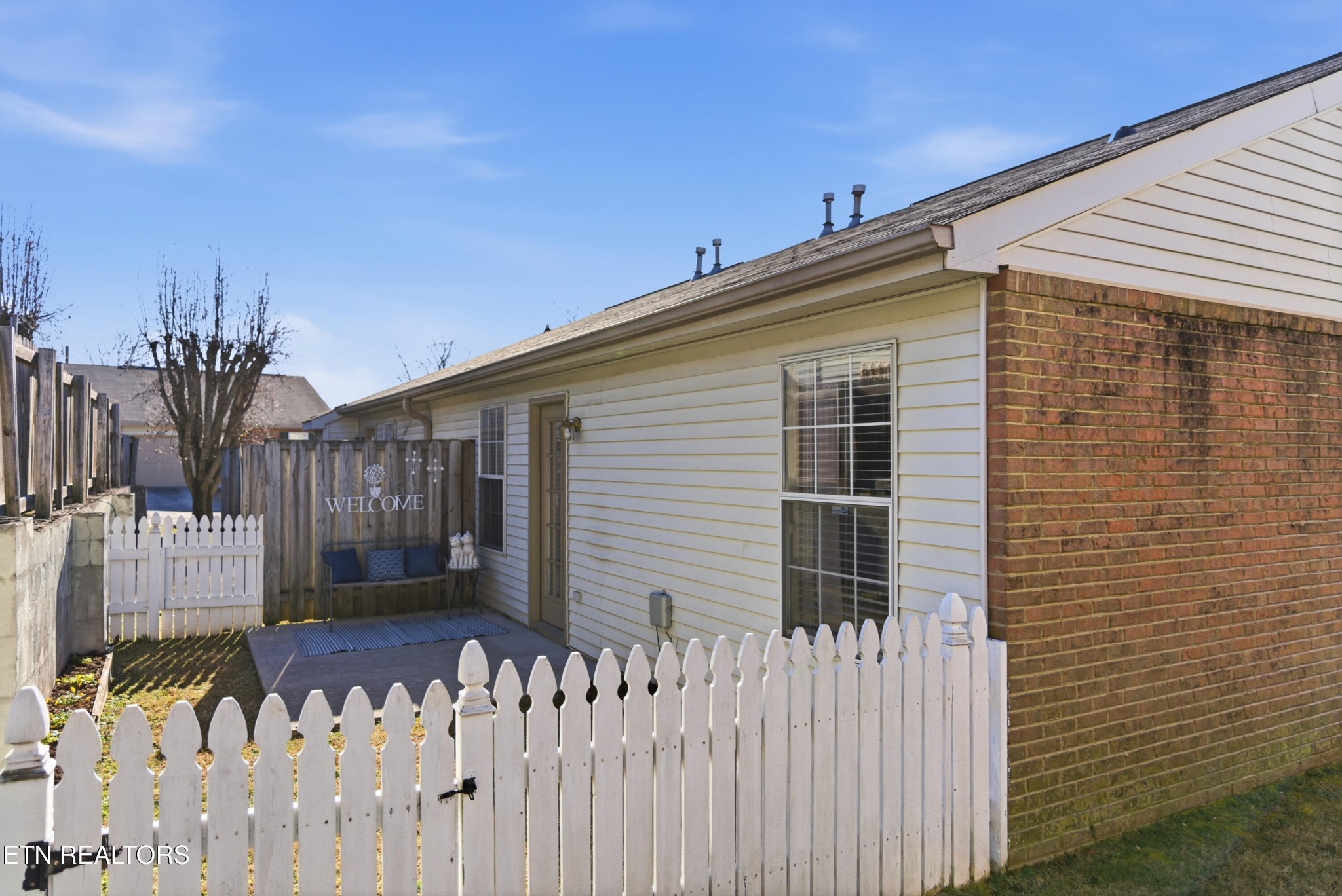 8009 Chambord Way Powell, TN 37849 - Photo 29 of 32 a front view of a house with a fence
