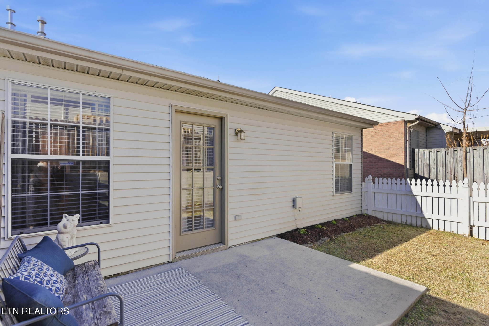 8009 Chambord Way Powell, TN 37849 - Photo 30 of 32 a view of a house with a wooden deck and a rug