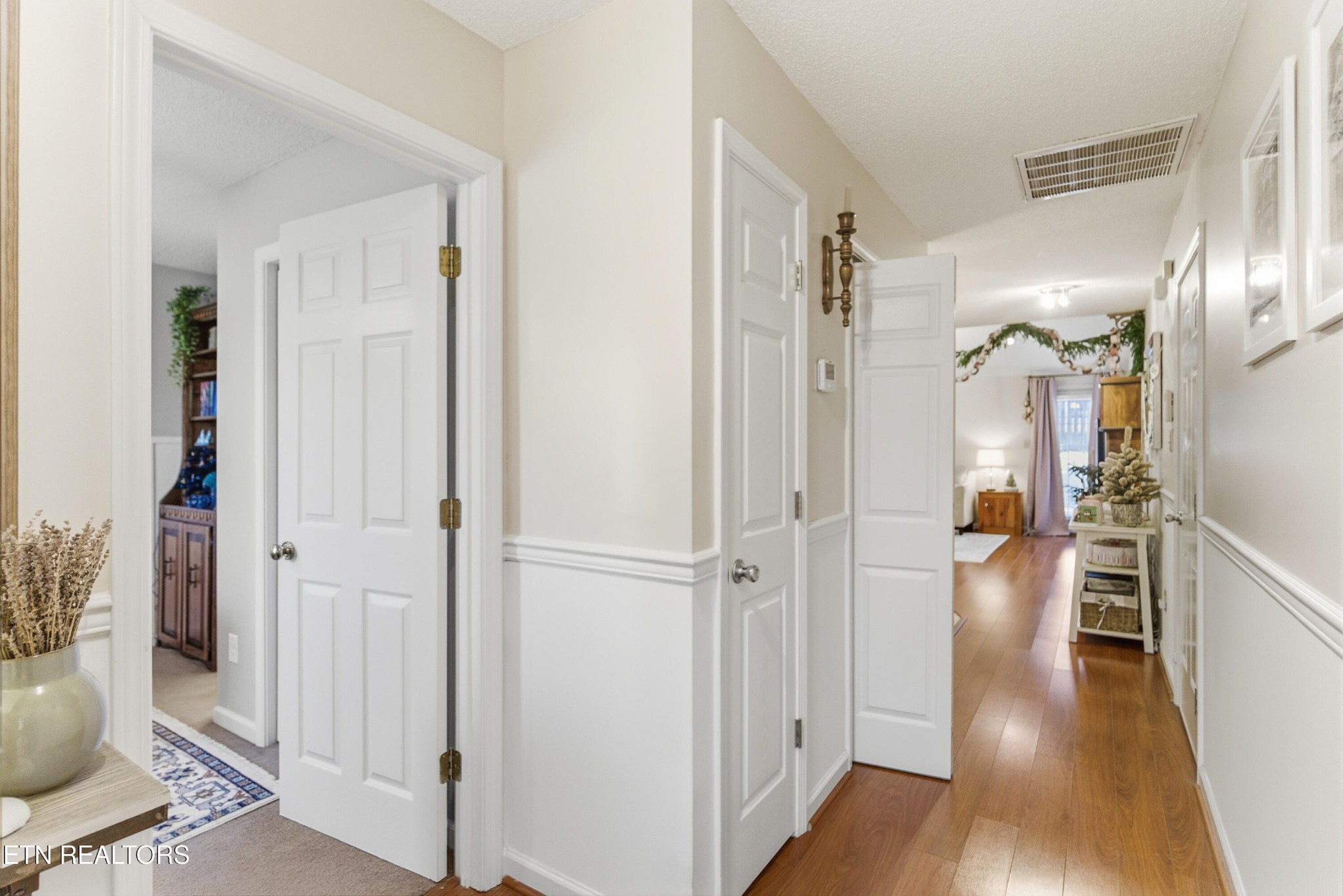 8009 Chambord Way Powell, TN 37849 - Photo 4 of 32 a view of entryway with livingroom and wooden floor