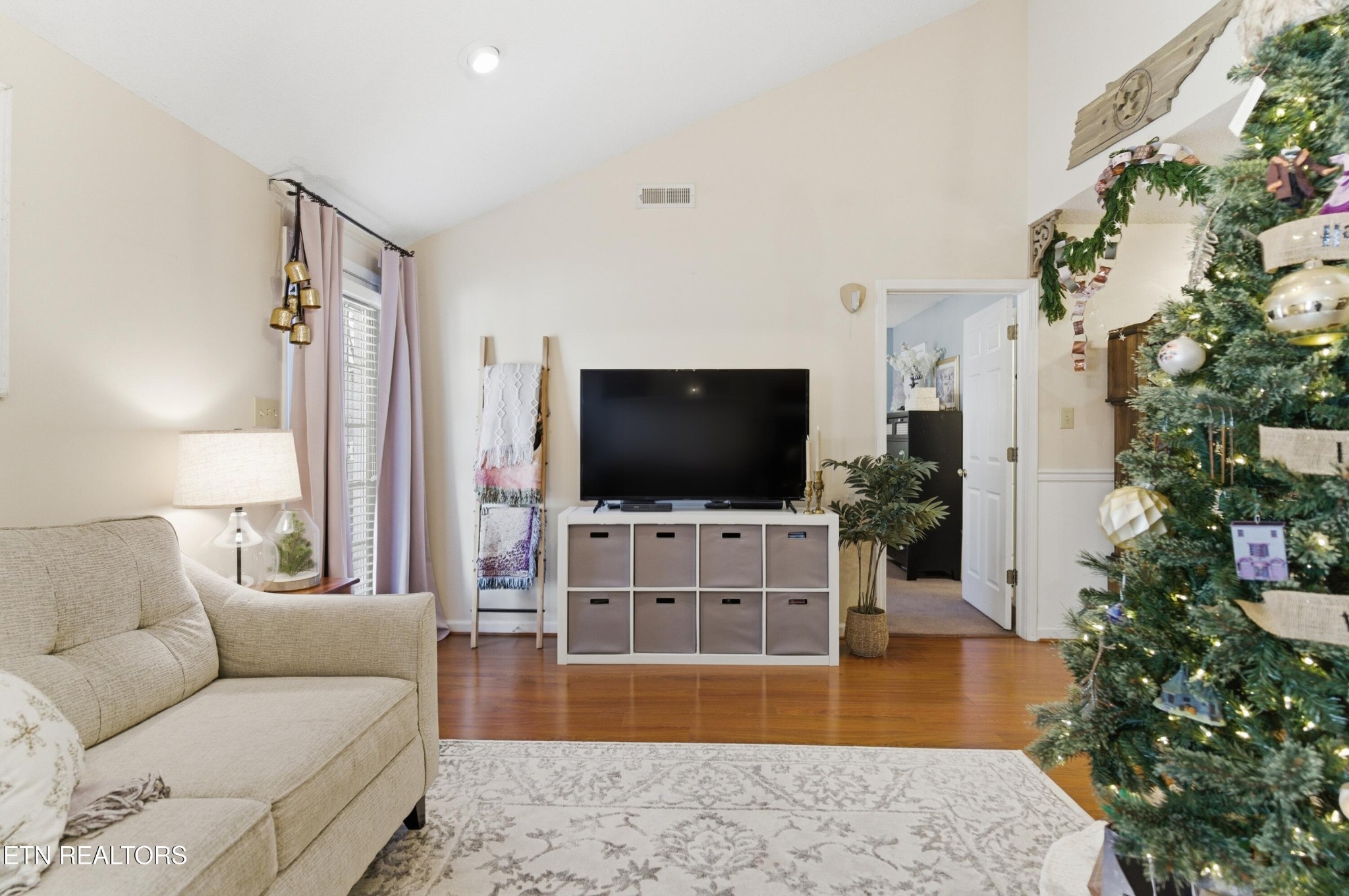 8009 Chambord Way Powell, TN 37849 - Photo 8 of 32 a living room with furniture and a flat screen tv