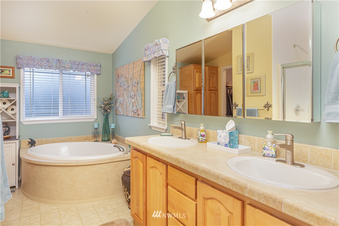 364 Port Hadlock Heights Road Port Hadlock, WA 98339 - Photo 18 of 30 a bathroom with a granite countertop sink and a mirror