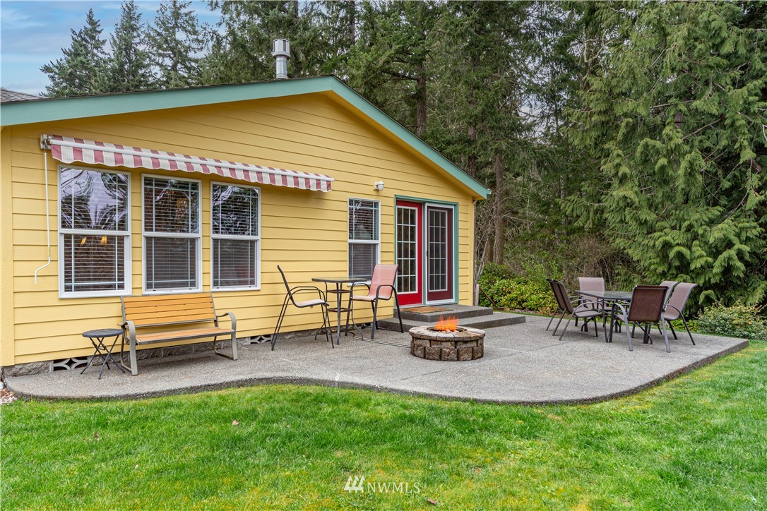 364 Port Hadlock Heights Road Port Hadlock, WA 98339 - Photo 3 of 30 a backyard of a house with table and chairs