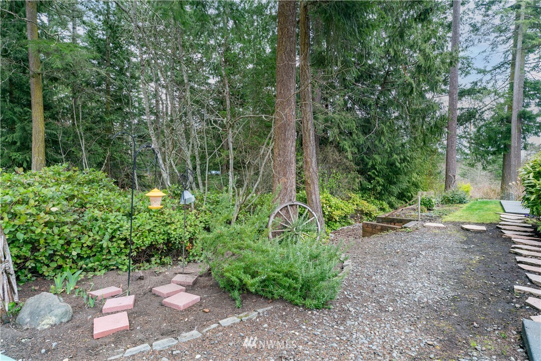 364 Port Hadlock Heights Road Port Hadlock, WA 98339 - Photo 4 of 30 a backyard of a house with lots of green space
