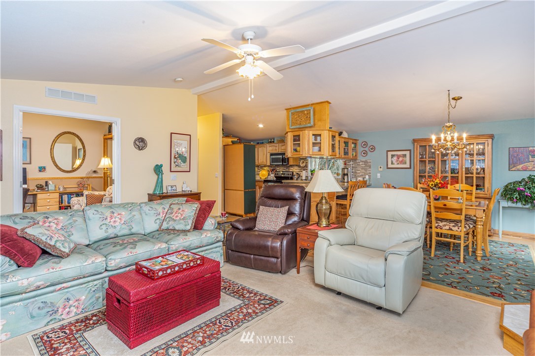 364 Port Hadlock Heights Road Port Hadlock, WA 98339 - Photo 7 of 30 a living room with furniture a rug and a chandelier