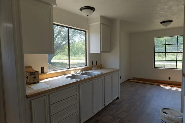 a kitchen with a sink and a window