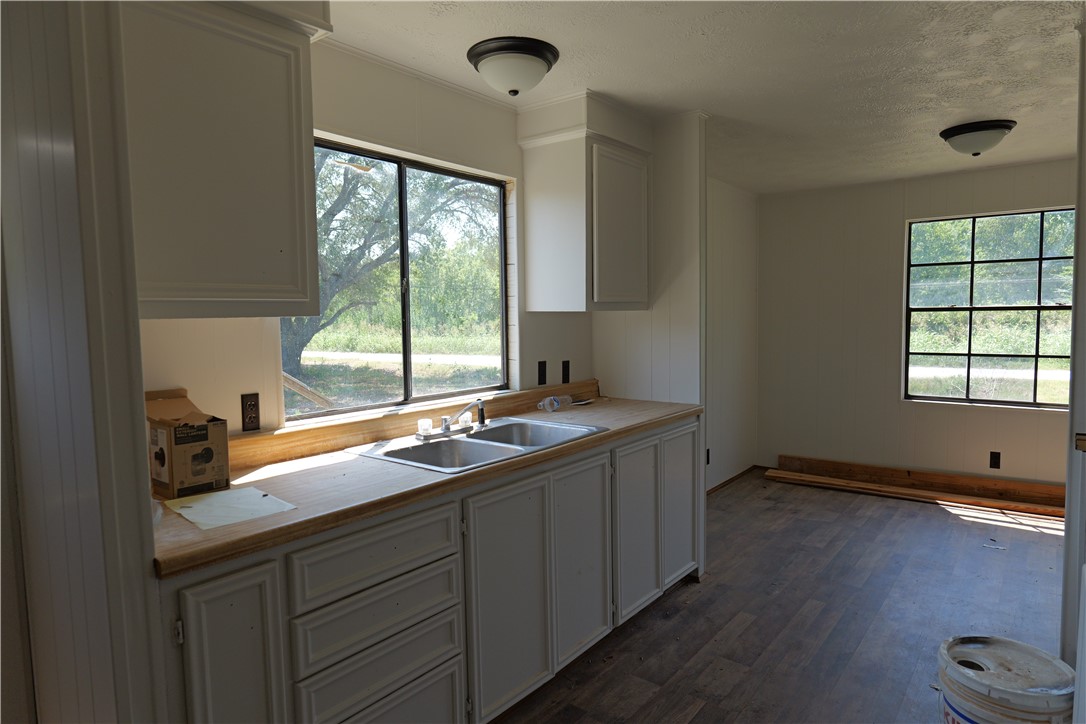 732 F Rogers Street Normangee, TX 77871 - Photo 2 of 8 a kitchen with a sink and a window