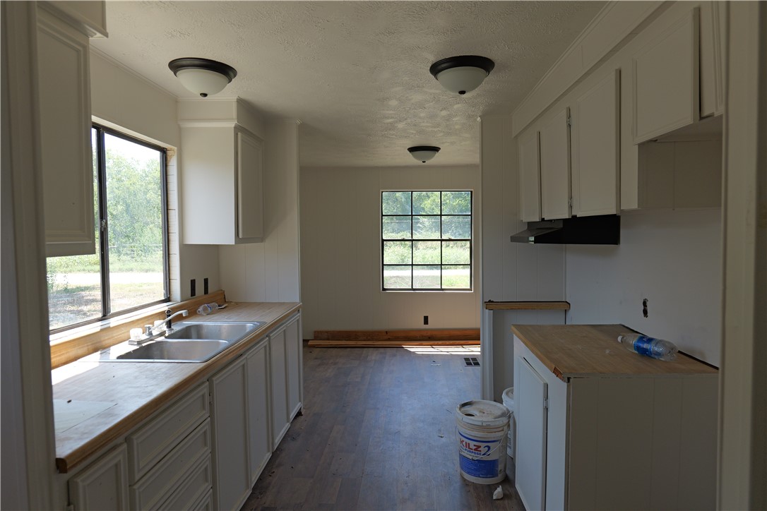 732 F Rogers Street Normangee, TX 77871 - Photo 3 of 8 a kitchen with a refrigerator and a stove