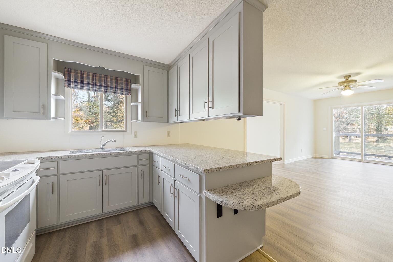 1012 Akron Avenue Durham, NC 27713 - Photo 13 of 43 a kitchen with a sink stove and cabinets