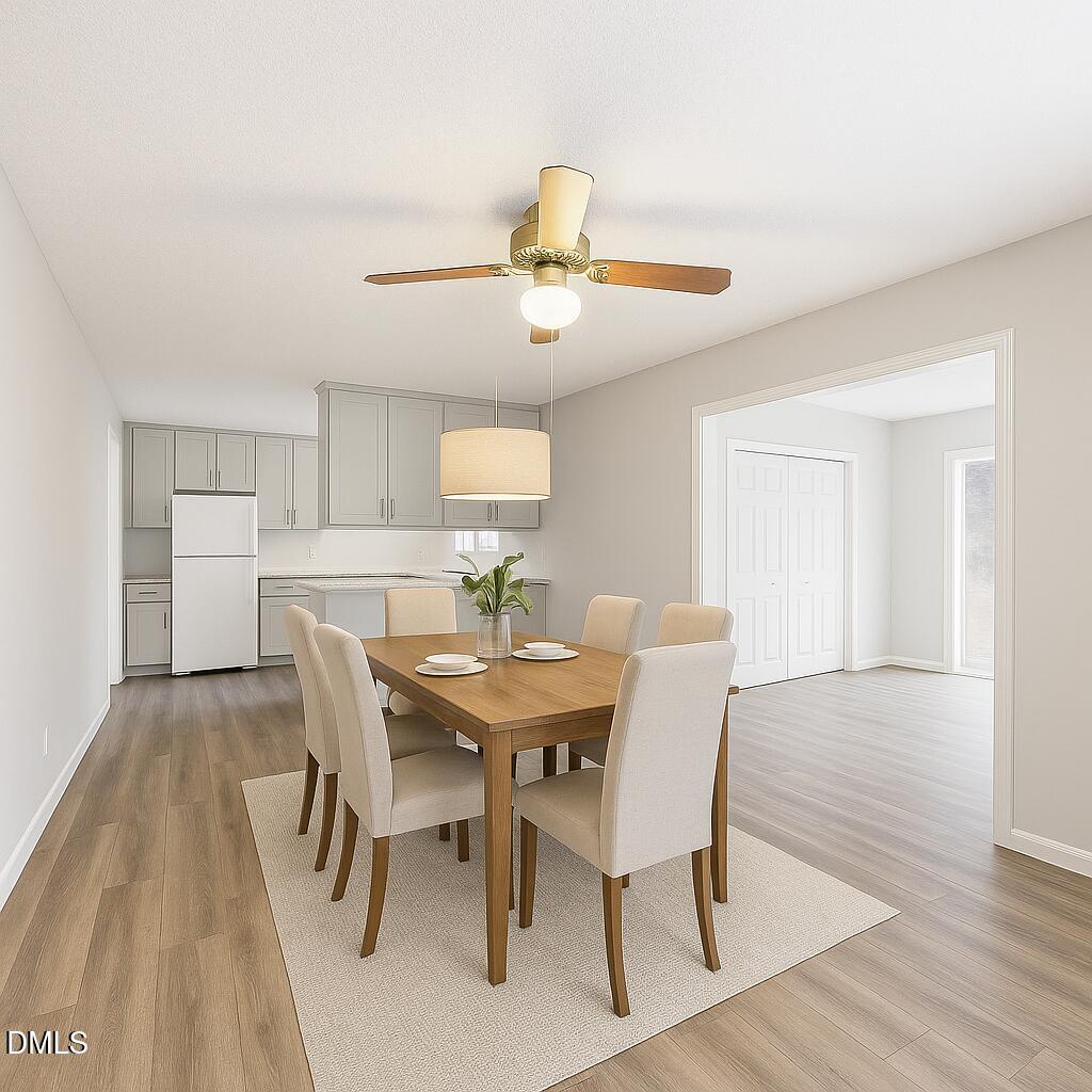 1012 Akron Avenue Durham, NC 27713 - Photo 14 of 43 a view of a dining room with furniture and wooden floor