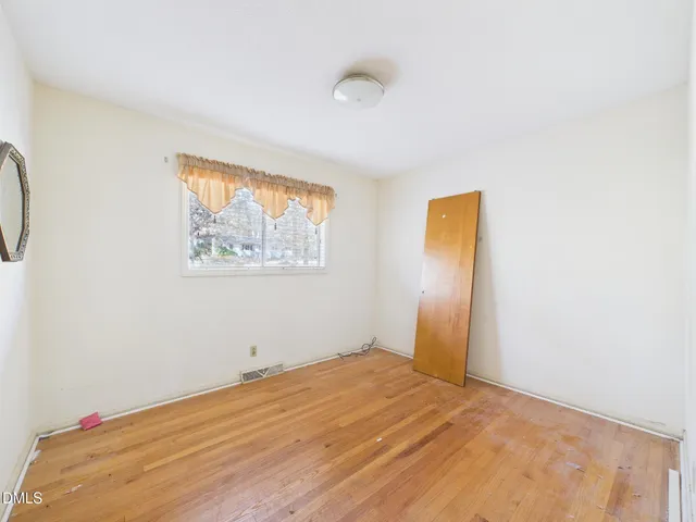 a bathroom with a sink a toilet and a large mirror