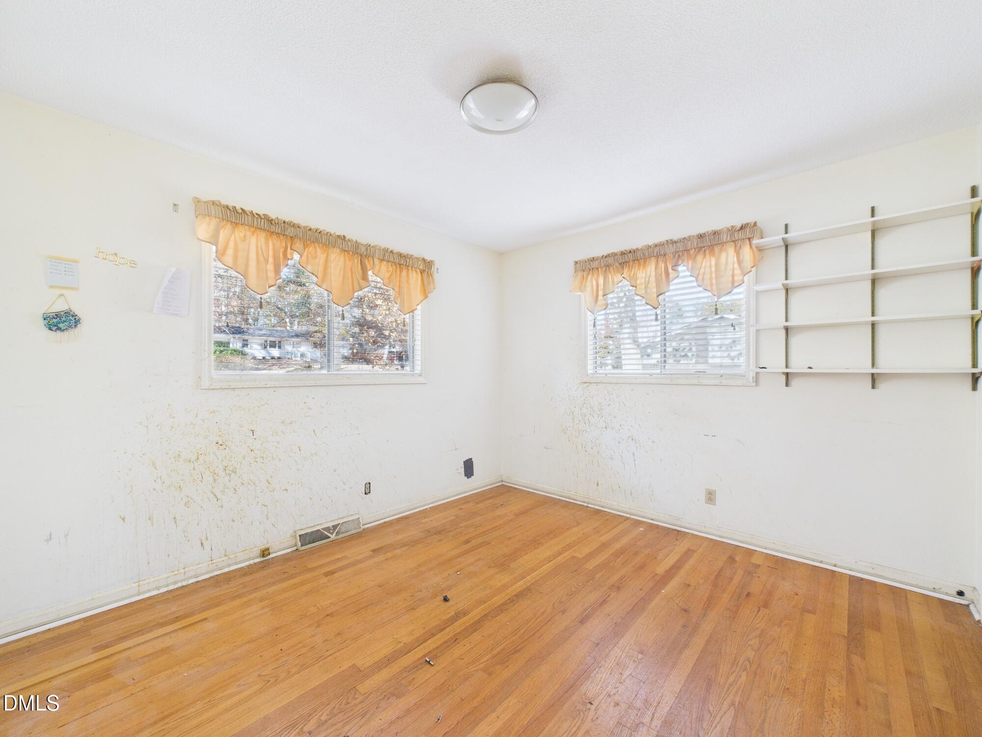 1012 Akron Avenue Durham, NC 27713 - Photo 21 of 43 a view of empty room with wooden floor and fan