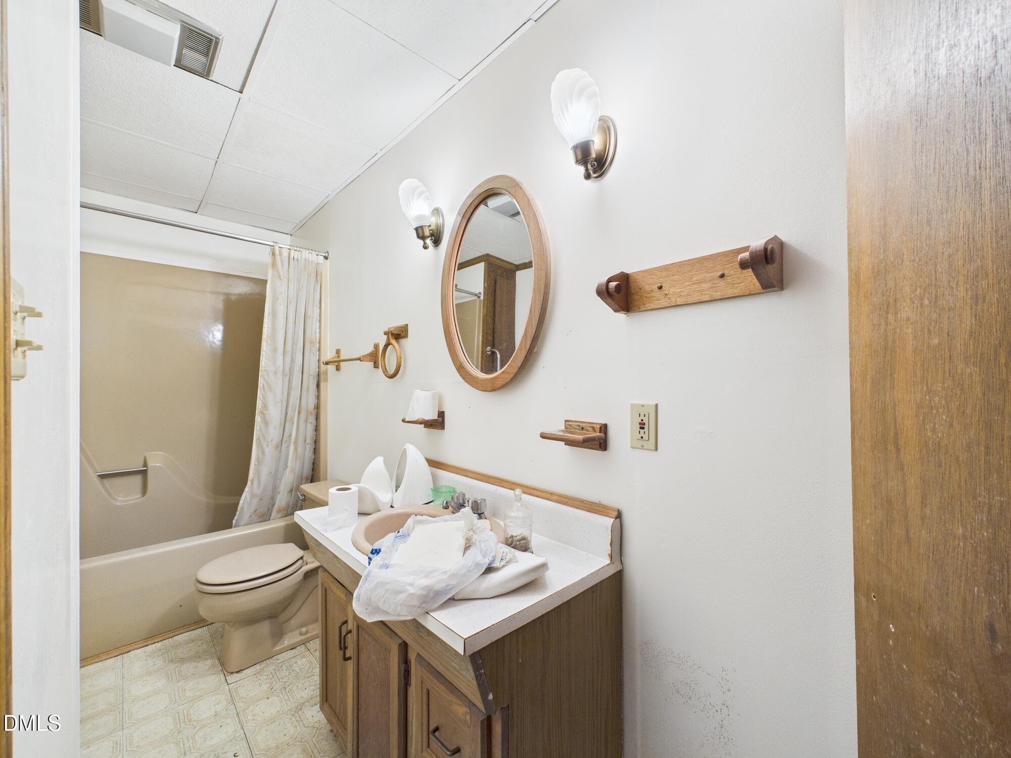 1012 Akron Avenue Durham, NC 27713 - Photo 30 of 43 a bathroom with a sink and a mirror