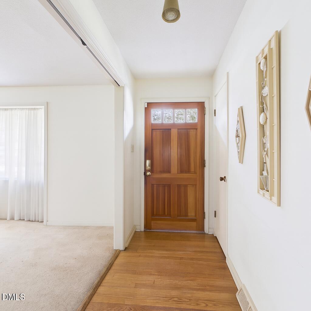 1012 Akron Avenue Durham, NC 27713 - Photo 5 of 43 a view of a hallway with wooden floor
