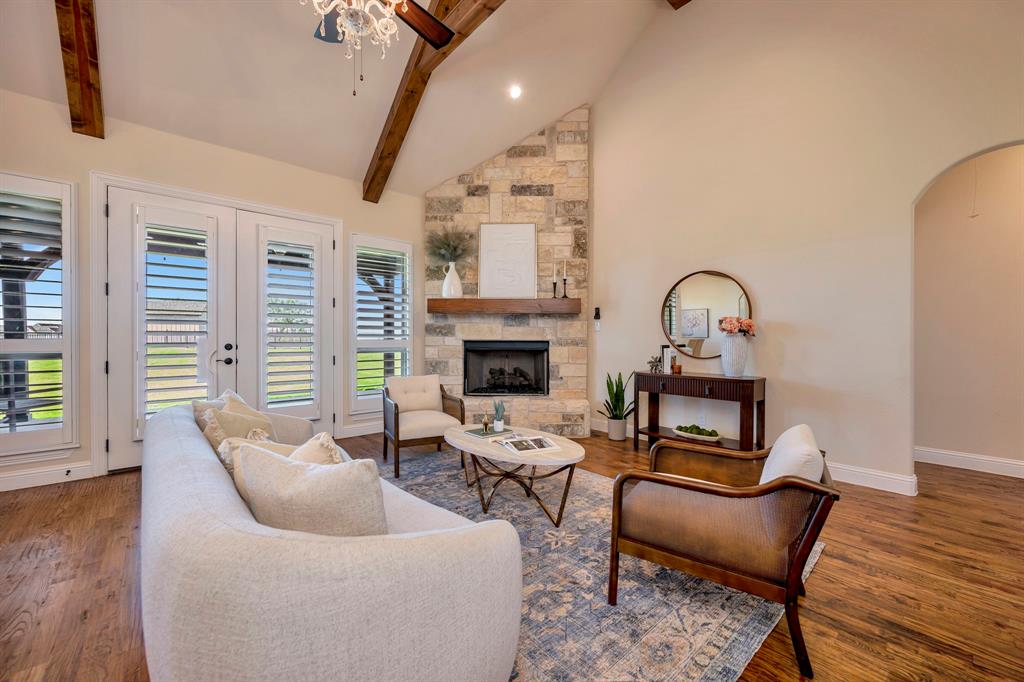3800 Ridge Point Drive Northlake, TX 76226 - Photo 11 of 39 a living room with furniture a fireplace and a flat screen tv