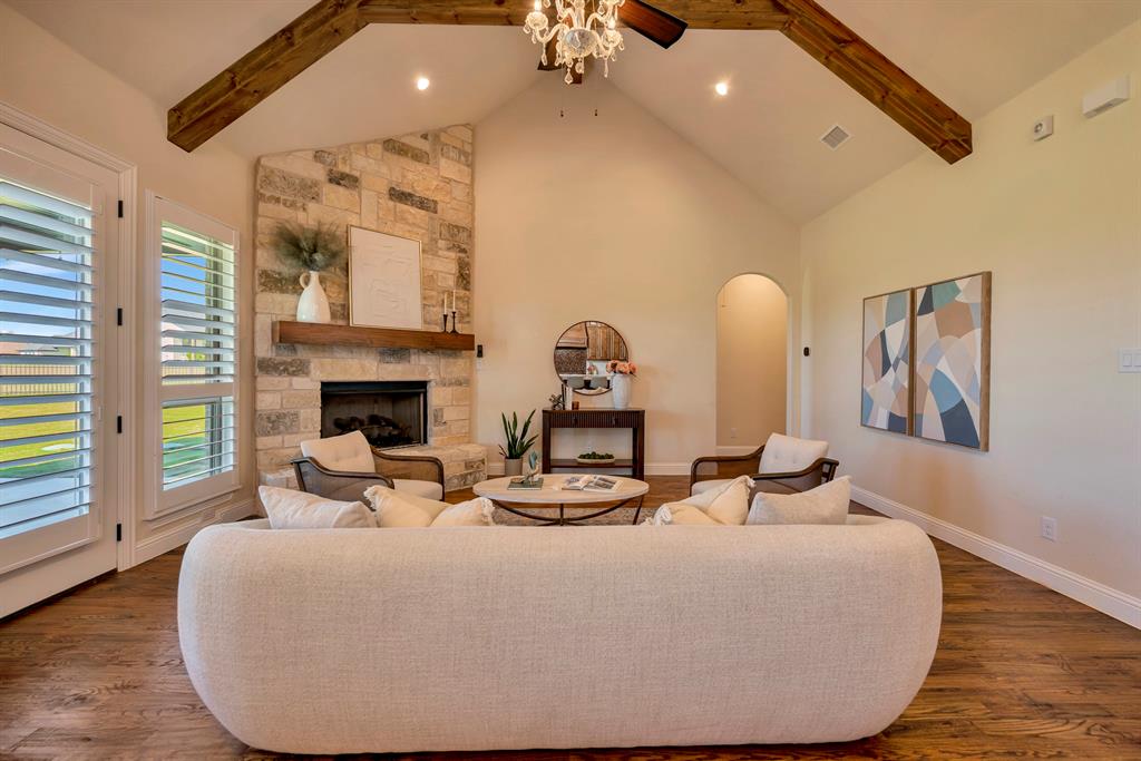 3800 Ridge Point Drive Northlake, TX 76226 - Photo 12 of 39 a living room with furniture a fireplace and a floor to ceiling window