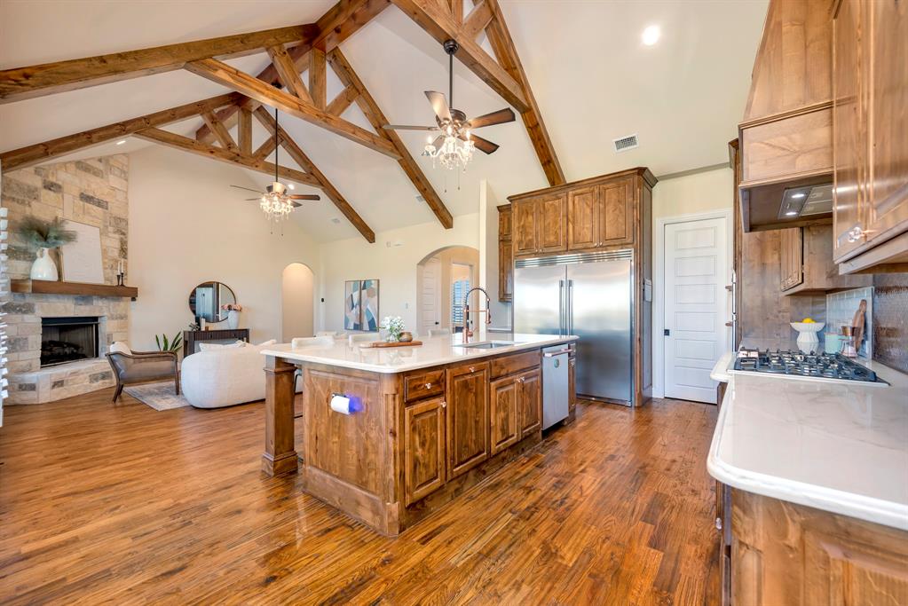 3800 Ridge Point Drive Northlake, TX 76226 - Photo 39 of 39 a kitchen with stainless steel appliances granite countertop a sink a stove and wooden floors