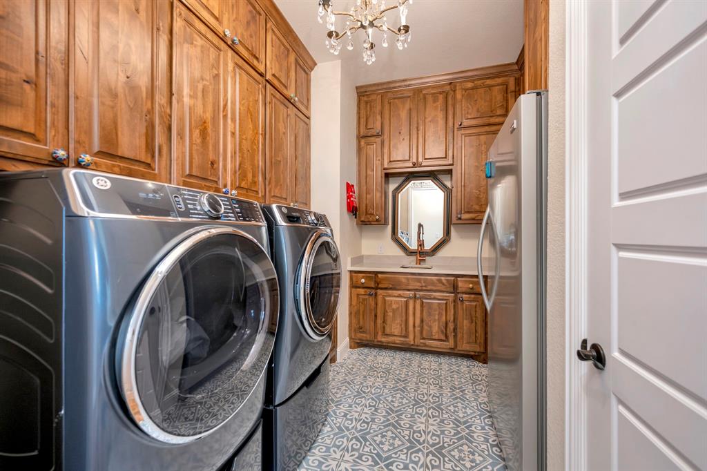 3800 Ridge Point Drive Northlake, TX 76226 - Photo 18 of 39 a utility room with sink dryer and washer