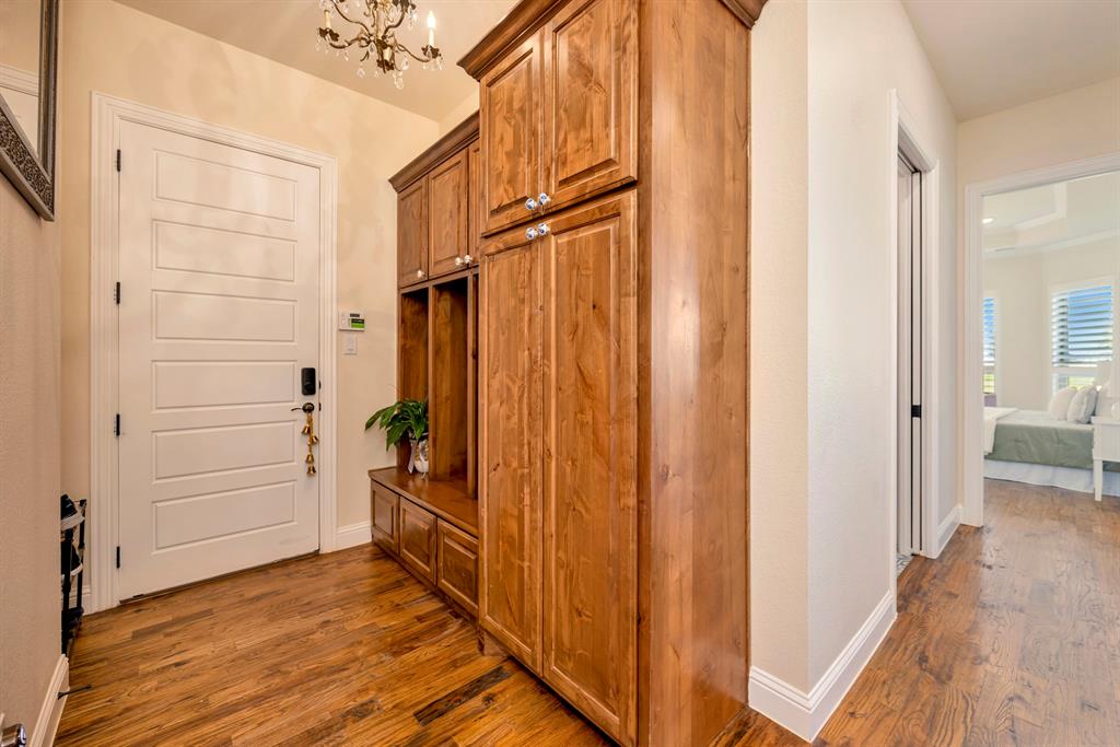 3800 Ridge Point Drive Northlake, TX 76226 - Photo 19 of 39 a view of a hallway with wooden floor and staircase