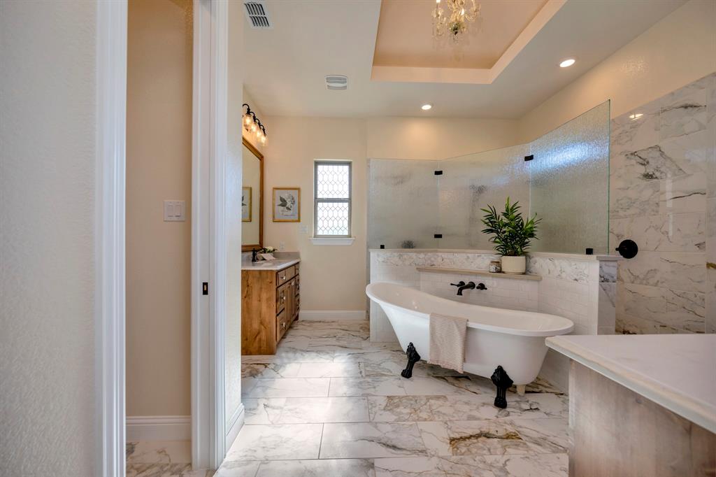 3800 Ridge Point Drive Northlake, TX 76226 - Photo 24 of 39 a spacious bathroom with a sink a tub and a mirror