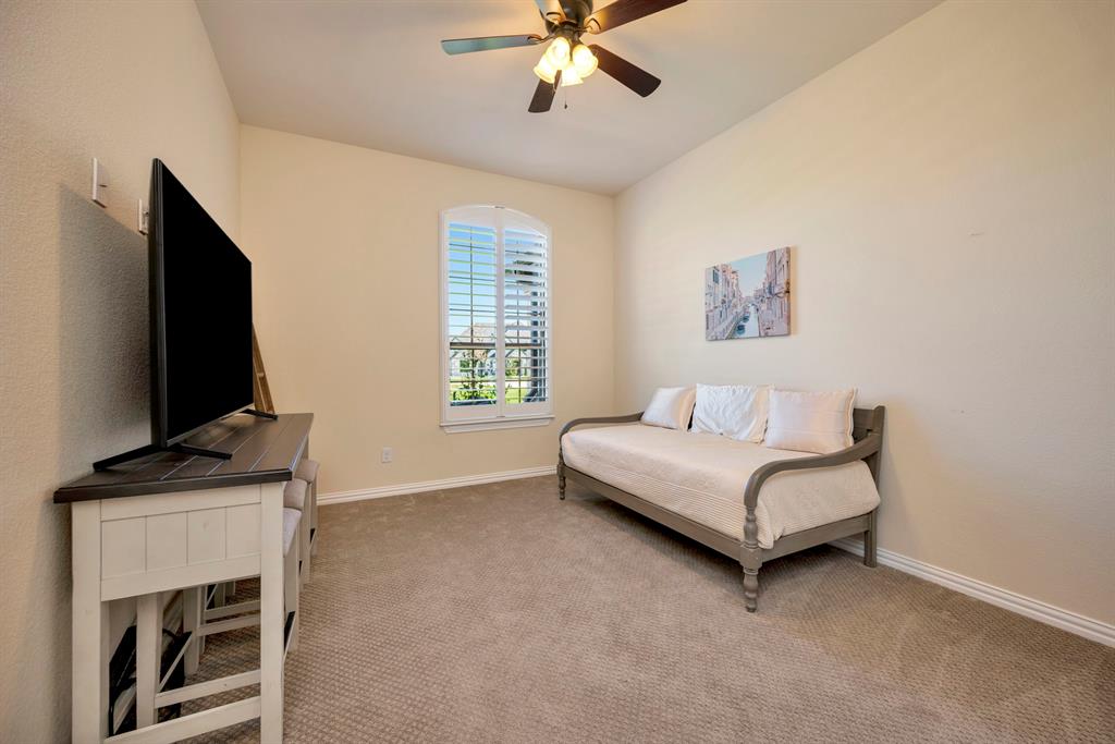 3800 Ridge Point Drive Northlake, TX 76226 - Photo 30 of 39 a living room with furniture and a flat screen tv
