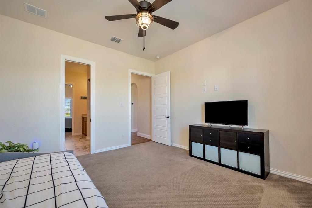 3800 Ridge Point Drive Northlake, TX 76226 - Photo 34 of 39 a living room with furniture and a flat screen tv