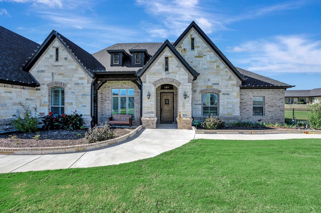 3800 Ridge Point Drive Northlake, TX 76226 - Photo 5 of 39 a front view of a house with a yard and porch