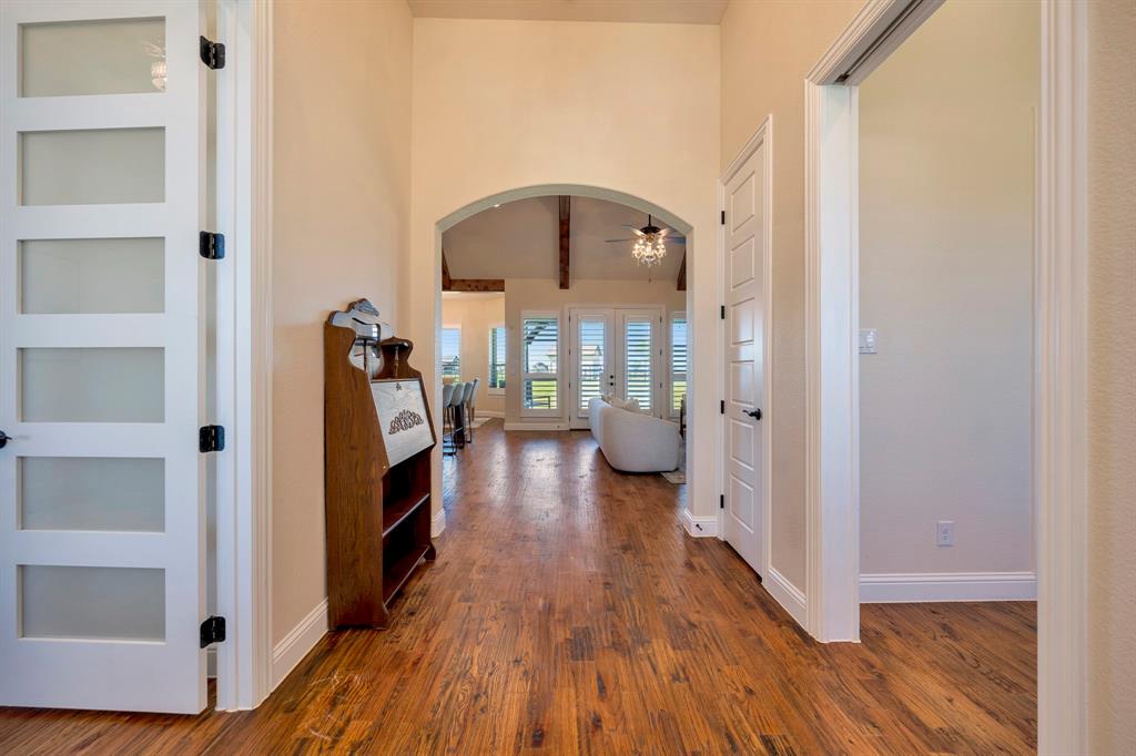 3800 Ridge Point Drive Northlake, TX 76226 - Photo 10 of 39 a view of a hallway with wooden floor and staircase