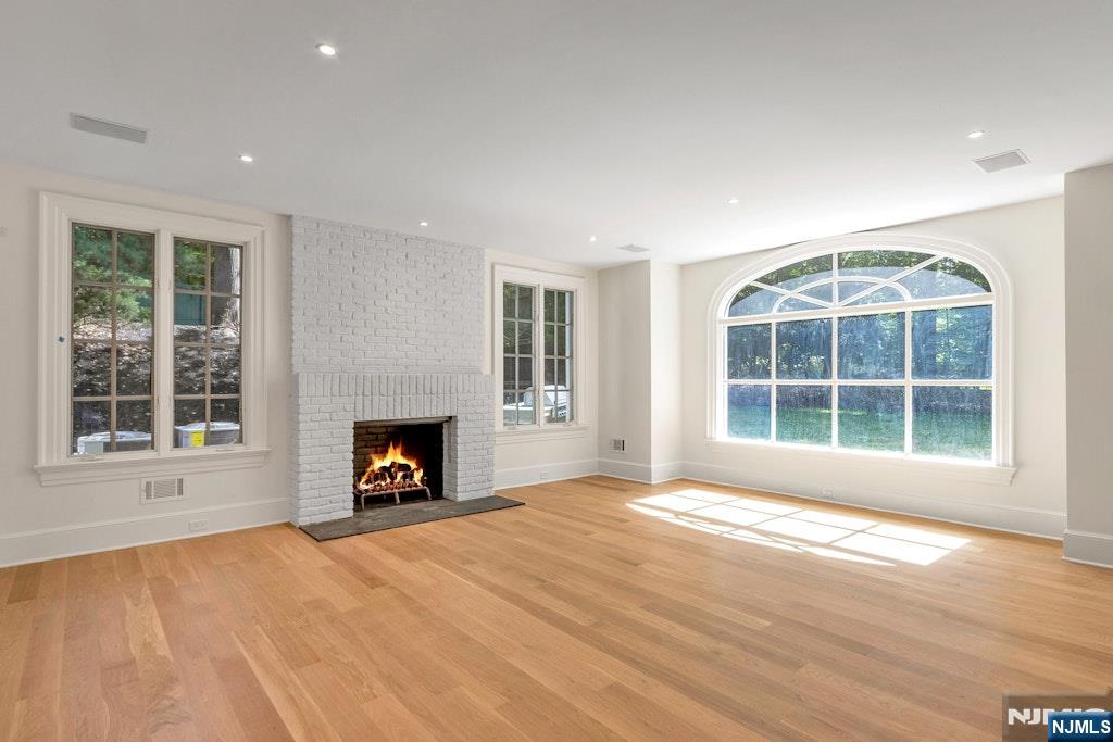 4 Duck Pond Road Alpine, NJ 07620 - Photo 13 of 35 a view of an empty room with a window and a fireplace
