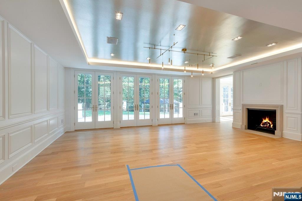 4 Duck Pond Road Alpine, NJ 07620 - Photo 15 of 35 a view of an empty room with a fireplace and a window