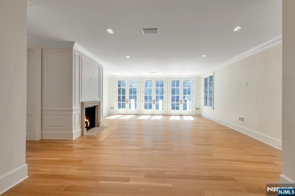 4 Duck Pond Road Alpine, NJ 07620 - Photo 16 of 35 a view of an empty room with a fireplace and a window