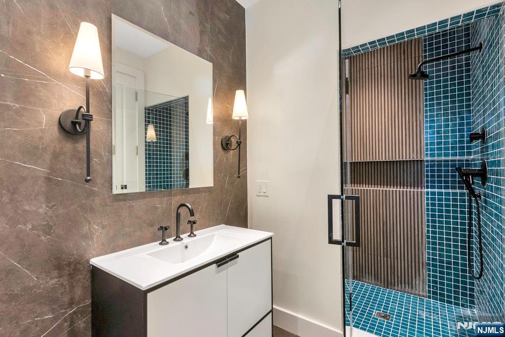 4 Duck Pond Road Alpine, NJ 07620 - Photo 22 of 35 a bathroom with a sink and a mirror