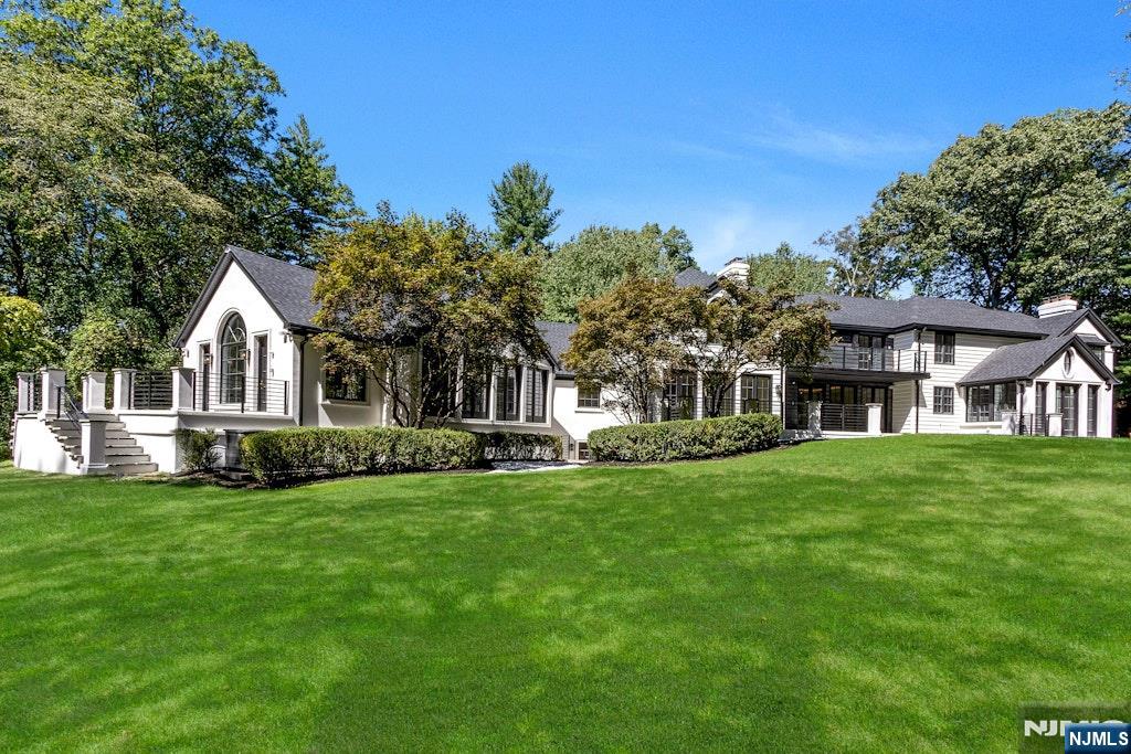 4 Duck Pond Road Alpine, NJ 07620 - Photo 34 of 35 a front view of a house with a garden