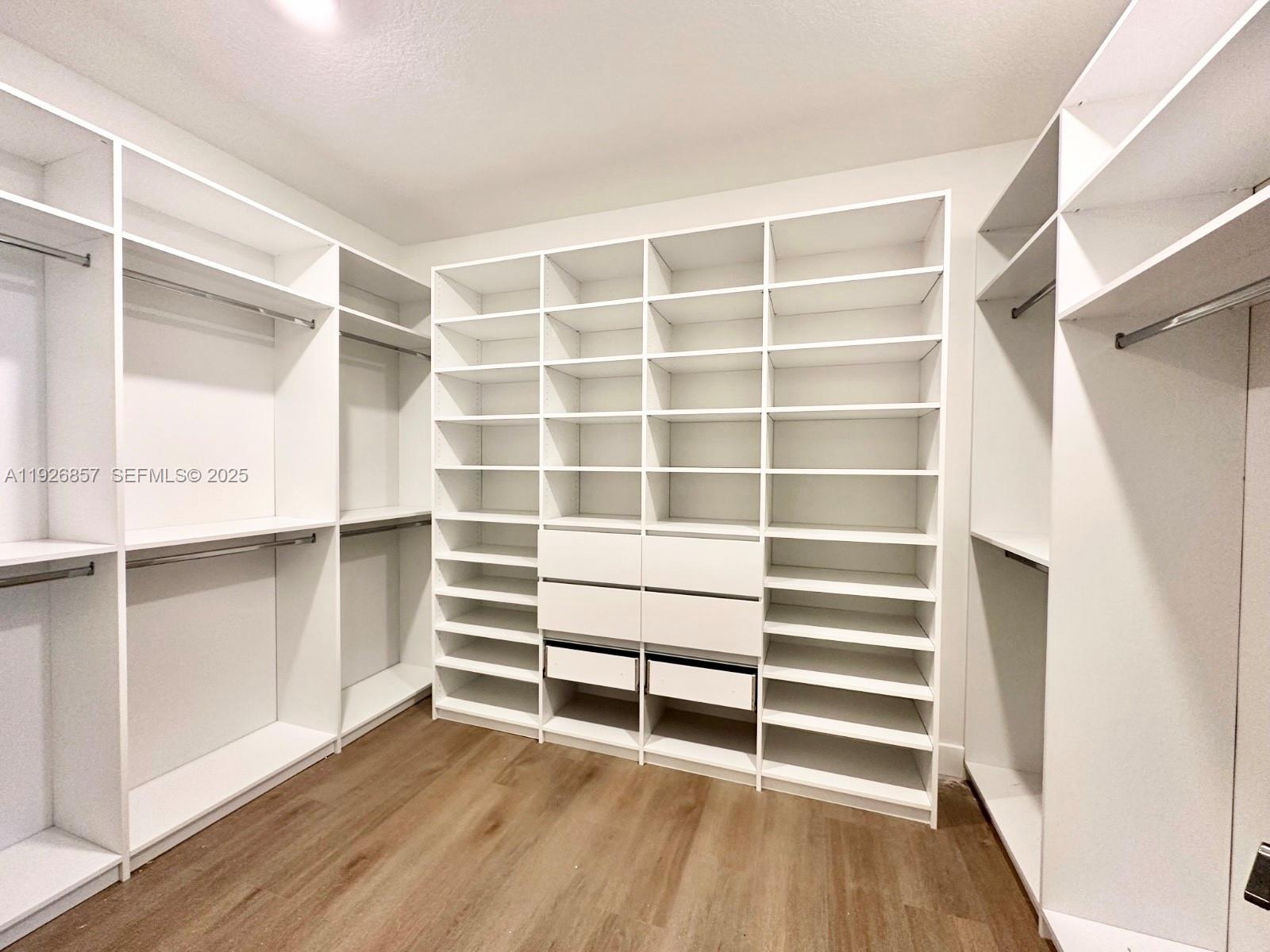4276 Southwest 173rd Avenue Miramar, FL 33029 - Photo 35 of 58 a view of walk in closet with empty racks