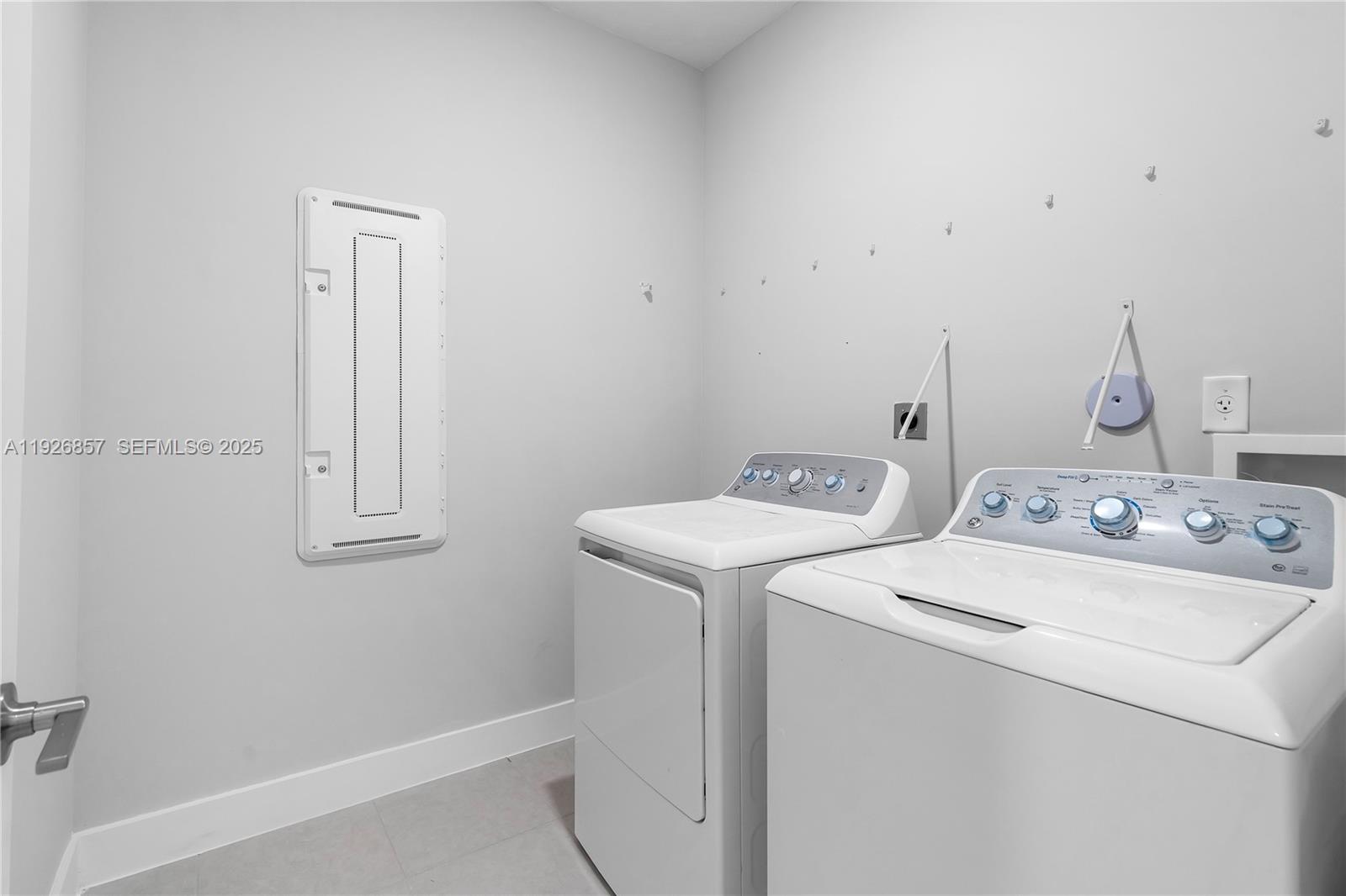 4276 Southwest 173rd Avenue Miramar, FL 33029 - Photo 41 of 58 a utility room with dryer and washer