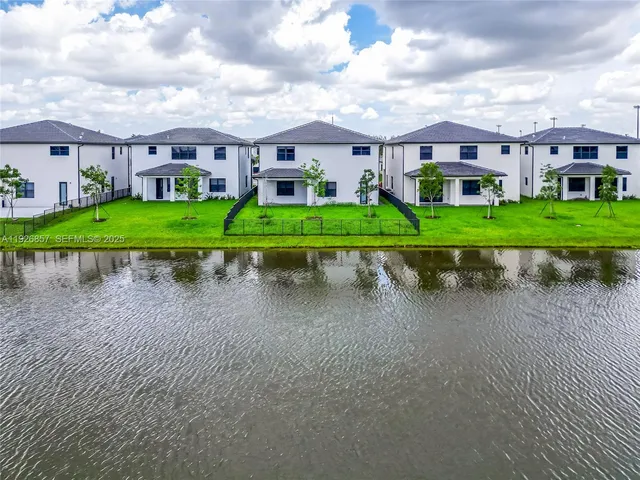 a view of house in front of house with a yard
