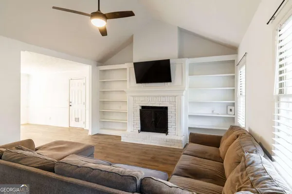 a living room with furniture or fireplace and a flat screen tv