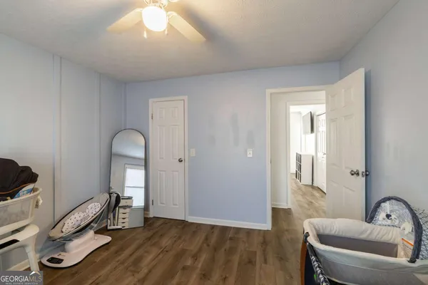 a view of a livingroom with furniture and windows