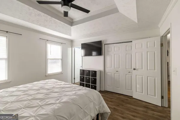 a bed room with a bed and a window