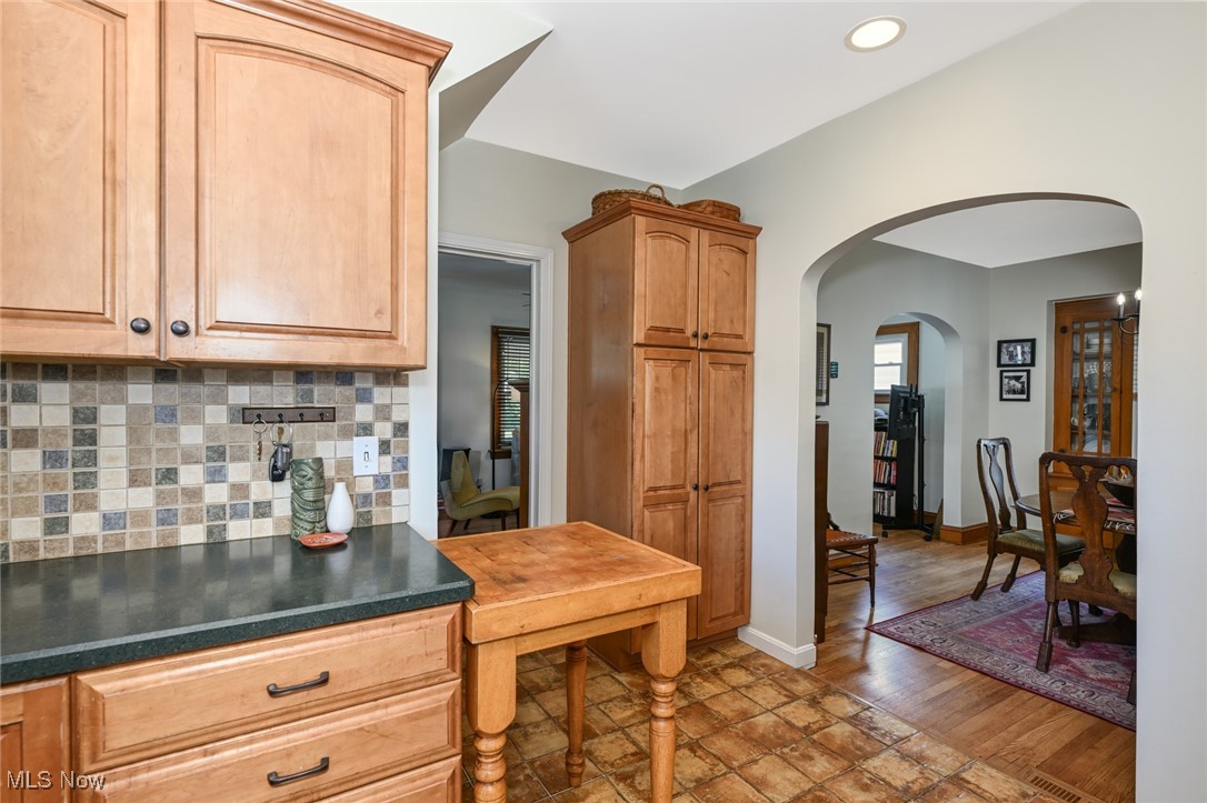 1236 Murray Avenue Akron, OH 44310 - Photo 12 of 29 Kitchen featuring arched walkways, backsplash, dark countertops, and recessed lighting