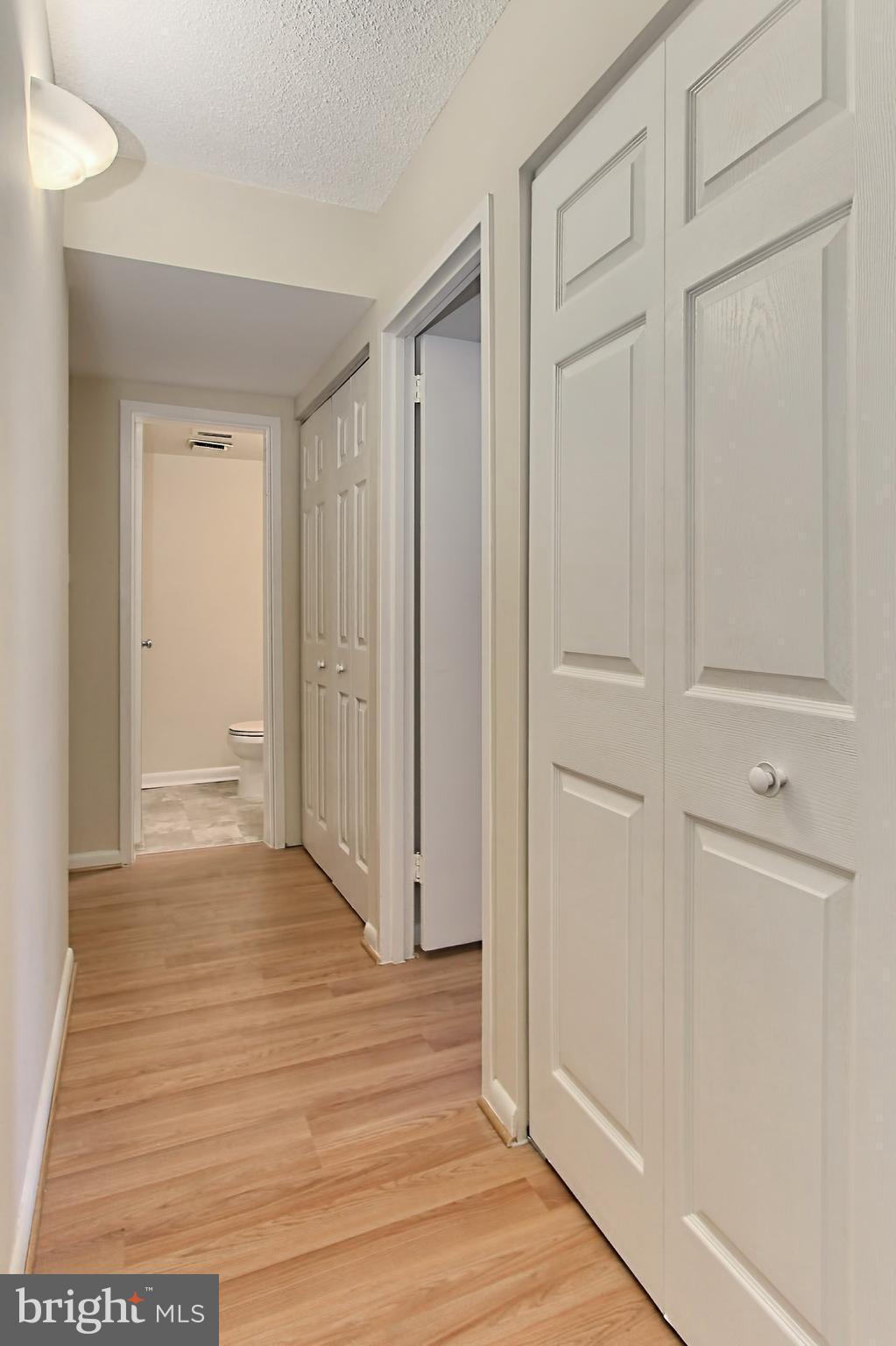 11625 Stoneview Square, Unit 2B Reston, VA 20191 - Photo 15 of 30 Hallway with new Laminate Flooring