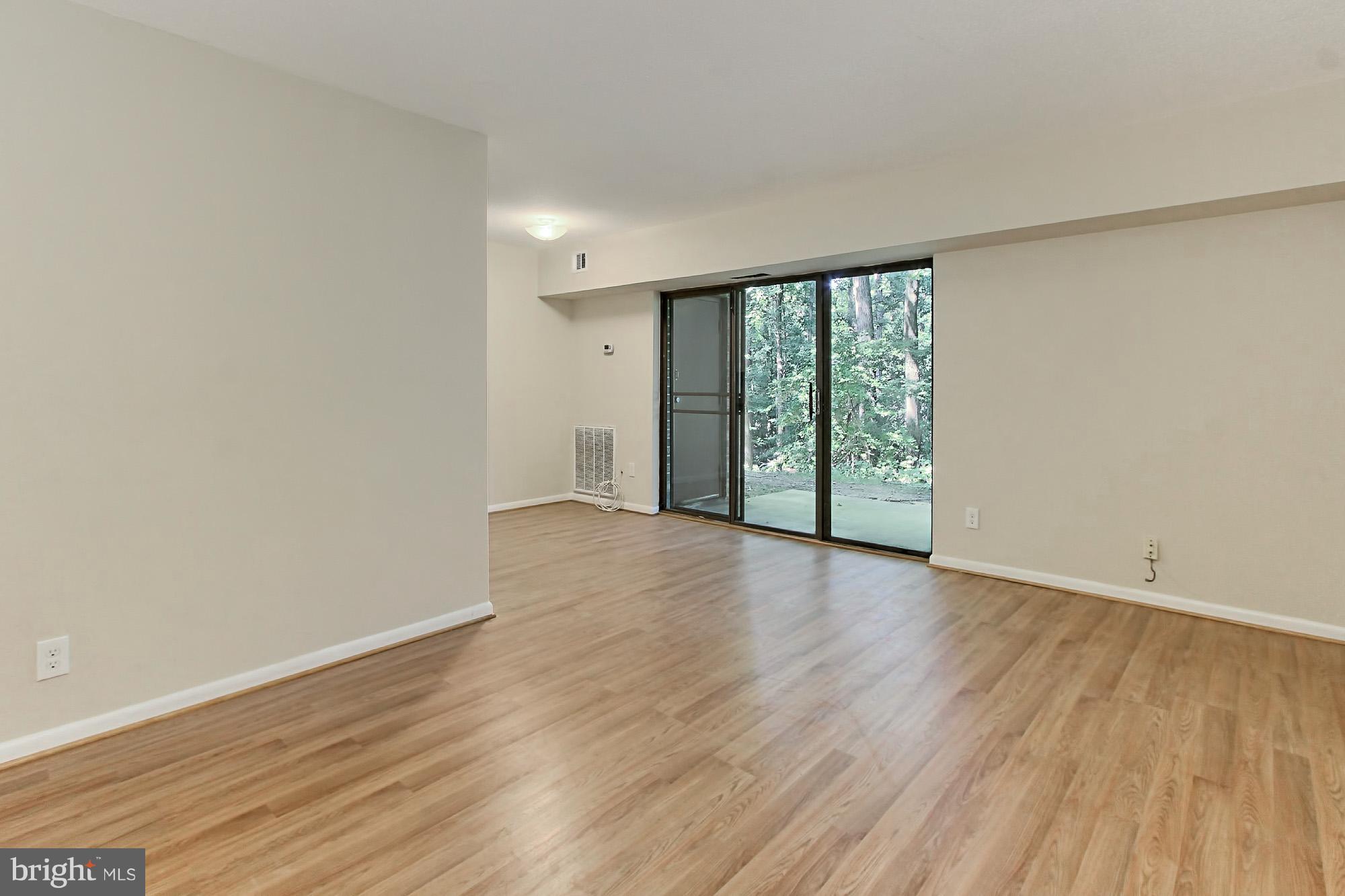 11625 Stoneview Square, Unit 2B Reston, VA 20191 - Photo 5 of 30 Living Room with new Laminate Flooring