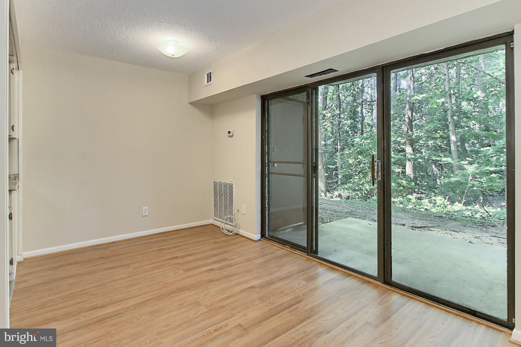 11625 Stoneview Square, Unit 2B Reston, VA 20191 - Photo 6 of 30 Dining Room with new Laminate Flooring